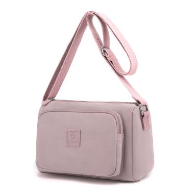 China Durable Ladies Fashion Urban Daily Life Women Waterproof Practical Solid Pink Color Simple Nylon Lightweight Messenger Bag for sale