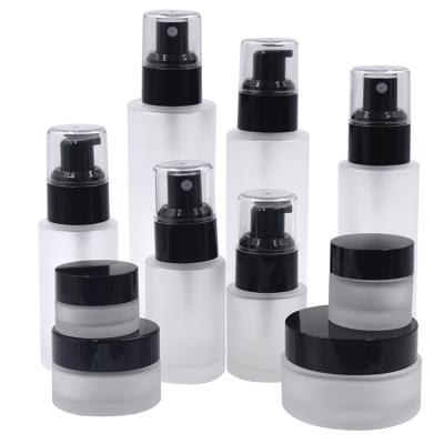 China Personal care cosmetic packaging frsoted spray pump glass bottle round glass lotion bottle and jar for sale