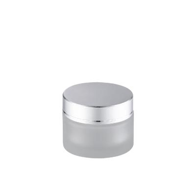 China Hot Selling Skin Care Cream Cosmetic Packaging Right Shoulder Frosted 30g Glass Cosmetic Jar With Shiny Silver Lid for sale