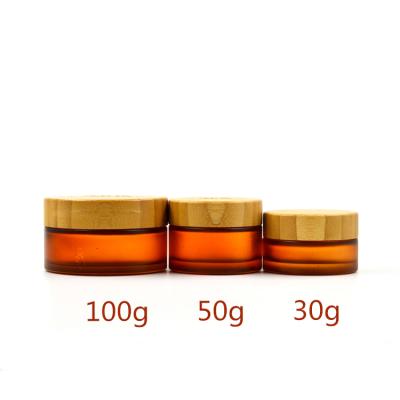 China 30g 50g 100g Skin Care Cream Amber Glass Cream Jar With Bamboo Lid Bamboo Jar With Bamboo Cap for sale