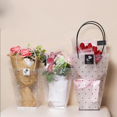 China Recyclable PVC Trapezoidal Waterproof Transparent Gift Bag Plastic Florist Party Packaging Bag Holiday Flower Bags for sale