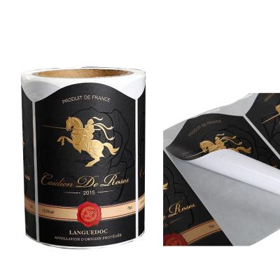 China Custom Printing Self Adhesive Paper Sticker Waterproof Logo Bottle Label Sticker Roll Embossed by Gold Foil for sale