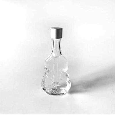 China Personal Care 40ml Screw Lid Violin Perfume Bottle Clear Cut Glass Essential Oil Dispenser for sale