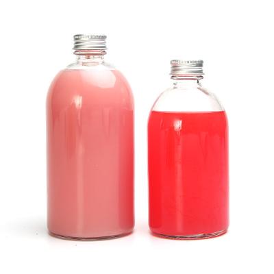 China 500ml Clear Glass Beverage Bottle Fruit Soda Bottle Boston Milk Round Bottle Enzymes, Essential Oils, Plum Wine for sale