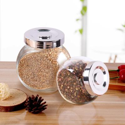 China 50ml/180ml/280ml/380ml/480ml Clear Flat Shape Food Storage Drum Jar Candy Glass Jar Glass Spice Jar With Silver Plastic Lid for sale