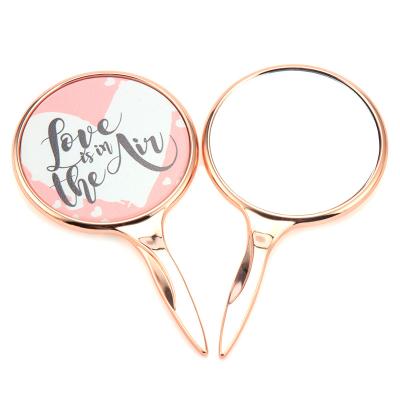 China Small New Design Glitter Magnifying Oval Modern Mirror With Handle for sale