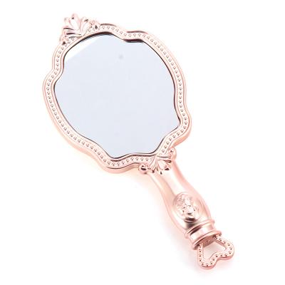 China Custom Simple Style Magnifying Girl's Gift Hand Held Makeup Mirror With Logo for sale