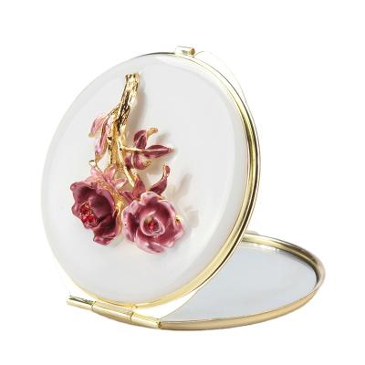 China 7cm Mini Metal Makeup Mirror Ladies Enamel Pocket Folding Magnifying Mirror Rose Flower Design Jewelry Contract Mirror for sale