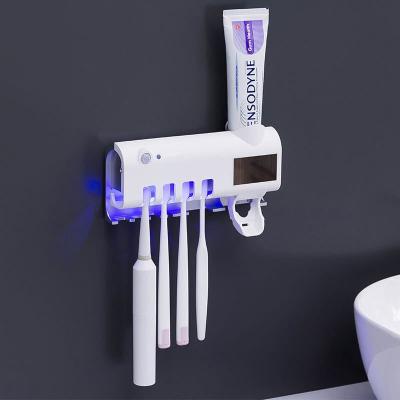 China Sustainable Toothpaste Dispenser for Bathroom Automatic Toothpaste Squeezer Toothbrush Holder for sale