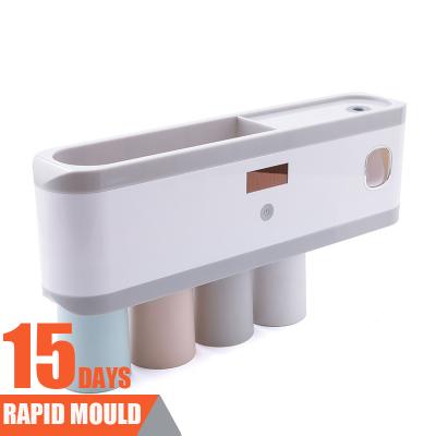 China New Arrival Sustainable Plastic Automatic Toothpaste Dispenser And Toothbrush Holder for sale