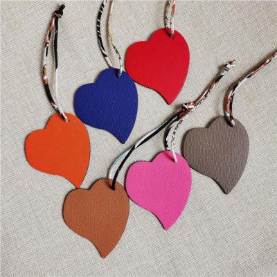 China Bag Charm Fashion Heart Shape Key Chain Genuine Leather Heart Pendant Charms For Bag for sale