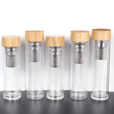 China Custom Printed Viable Promotion Logo Design Glass Cool Water Bottle With Laser Engraving Bamboo LID for sale