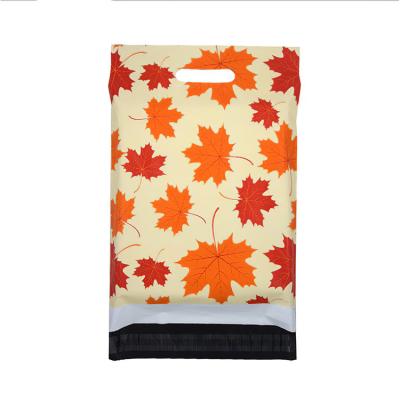 China Transport in stock fashion maple leaf with poly handle mailing envelopes mailer bags for clothes for sale