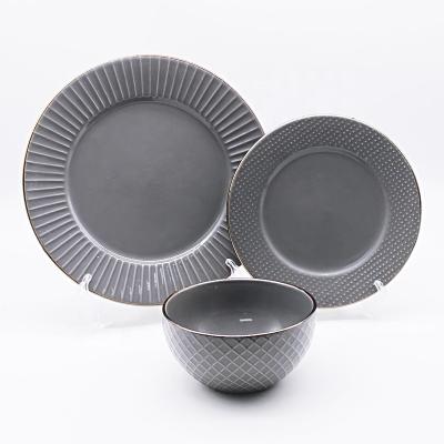 China Sustainable style modern black porcelain factory price Nordic ceramic dinnerware set with relief for sale