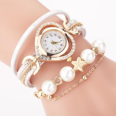 China Hot Sale Women's Gold Plated Women's Pearl Bracelet Watch Set Heart Rhinestone Wristwatch Set Leather Bracelet Watch Set for sale