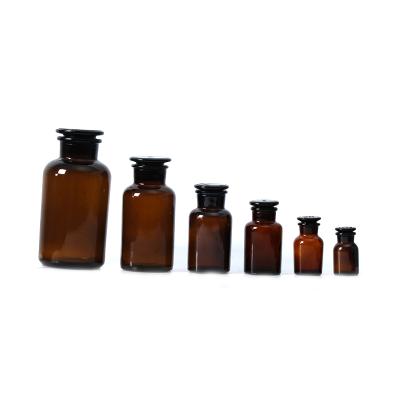 China Viable 125ml 250ml 500ml Pharmacy Knocks Matte Black Amber Apothecary Glass Bottle And Cap for sale