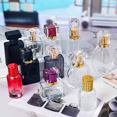 China Round 30ml/50ml/100ml Cosmetic Empty Glass Perfume Bottle Cap Cylinder Bottle Black Perfume for sale