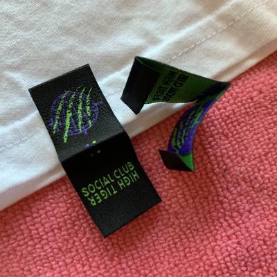 China Newest Design Sustainable Garment Edge Label , T-shirt Fabric Bottom Edge Label With Book Cover Fold for sale