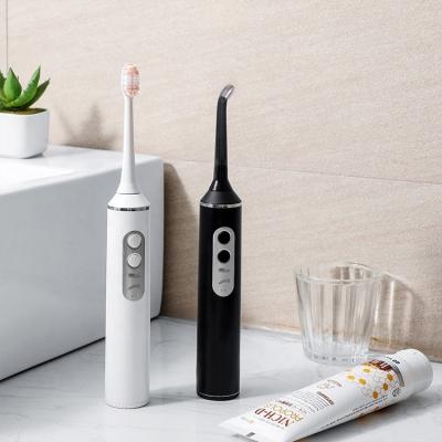 China Outdoor Rechargeable Electric Toothbrush With Water Portable Oral Flosser Irrigator for sale