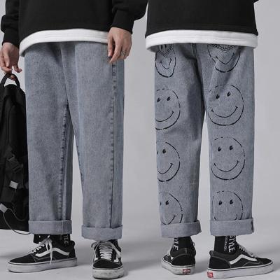 China 2021 QUICK DRY hip hop streetwear men fashion to medium blue denim loose pants loose printed bootcut jeans for sale