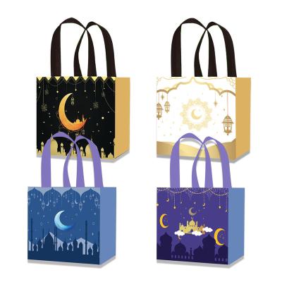 China Xindeli Recyclable WFF013 Eid Mubarak Non-Woven Bags with Handles Moon Lantern Design Sweets Candy Bags Tote Gift Bags for Ramadan Party for sale