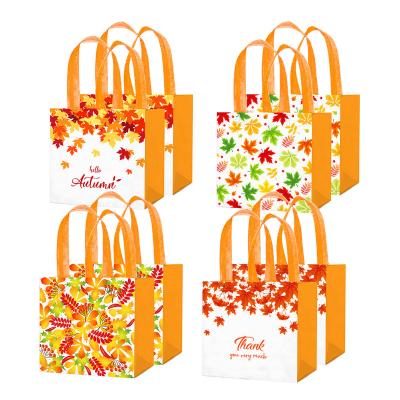 China Xindeli Recyclable WFF008 Hello Autumn Non-Woven Bags with Handles Maple Leaf Sweets Candy Tote Gift Bags for Thanksgiving Party Supplies for sale