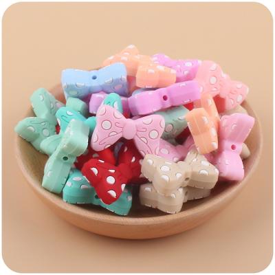 China Eco-friendly trending products new arrivals Bowknot patterned silicone beads diy kit baby toys teether 100% Food Grade Silicone for sale