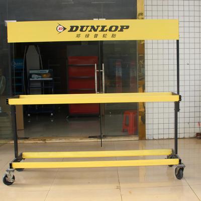 China Durable Wholesale Tire Retail Store Yellow Metal Floor Rack Display For Truck Car Tire Wheels Display Racks for sale