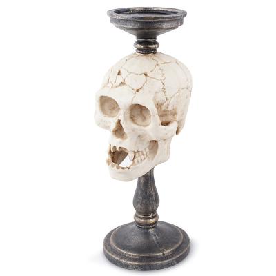 China Home Decoration Custom Resin Mat Candle Holder Luxury Skeleton Gold Candlestick Holder Wholesales Candle Jars For Home Decor Halloween Holiday for sale