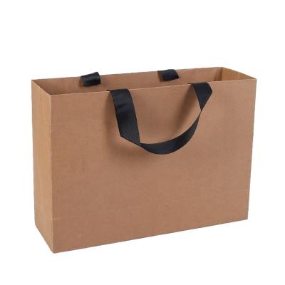 China Cheap Custom Printing Reusable Eco - Friendly Handled Kraft Paper Bag For Clothing Shopping for sale