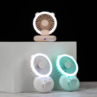 China Clip Feature/Pocket Battery Case 2021 Handheld Fans Mobile Cute Handheld Battery Mini Fan Portable Rechargeable Fan With Night Light for sale