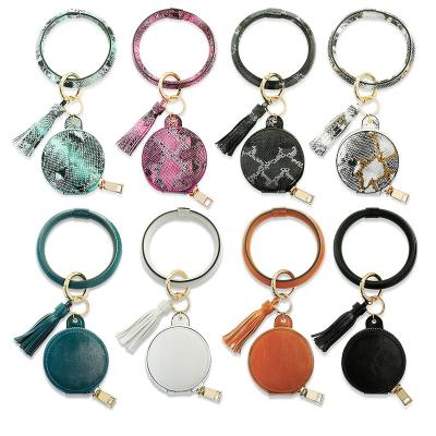 China Luxury Wristlets Bracelet Keychain Designer Key Chain PU Leather Bluetooth Headset Bag with Tassel Cosmetic Bracelet Mirror Makeup Key Chain for sale