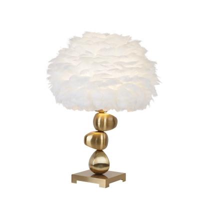 China Nordic modern white feather simple creative table lamp for bedroom living room home hotel for sale