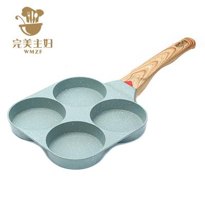 China Multi-Functional Customizable Size Heat Sensitive Customizable Copper Style Four-Hole Eggs Stove Silicone Stone Casserole for sale