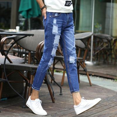 Chine Les femmes imprimées de denim amincissent les jeans droits de jambe avec la poche et les trous brodés à vendre