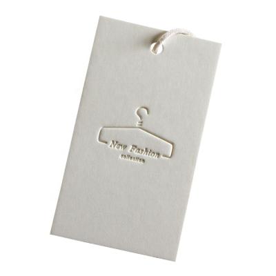 China Custom Viable Special Paper Hang Tag Price Embossed /Debossed Logo White Gift Paper Hang Tag 700gsm Clothing Handmade Tag for sale