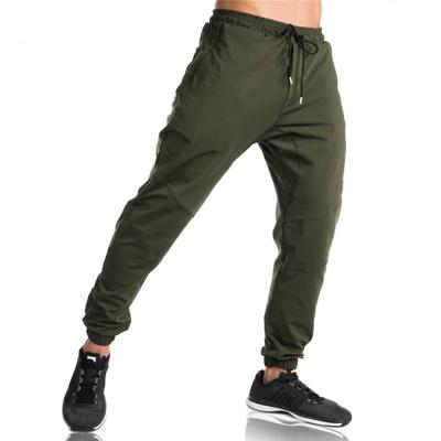 China Jogger Plus Size Zipper Pockets Mens Sweated Sports Pants Sides Splicing Track Pants For Men for sale