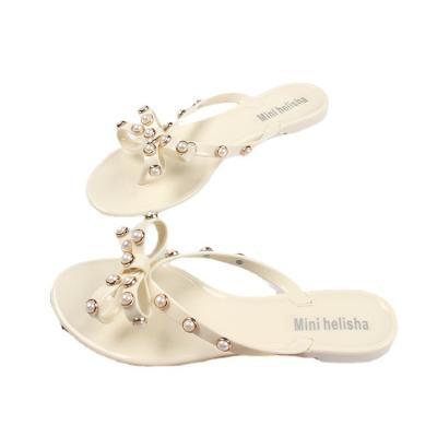 China CUSHIONING 2021 new fashion summer pearl butterfly flip flops solid color beach flip flops women casual flat sandals and slippers for sale