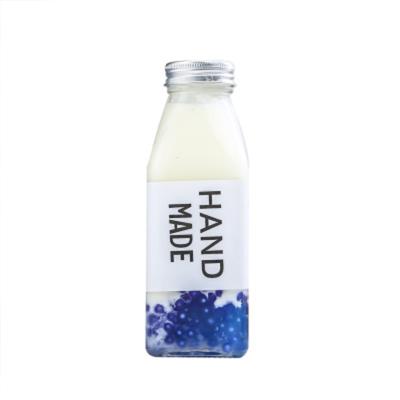 China Wholesale Glass Juice Bottles French Square Bottles From China Supplier Environmentally Friendly With Plastic Or Metal Lid for sale