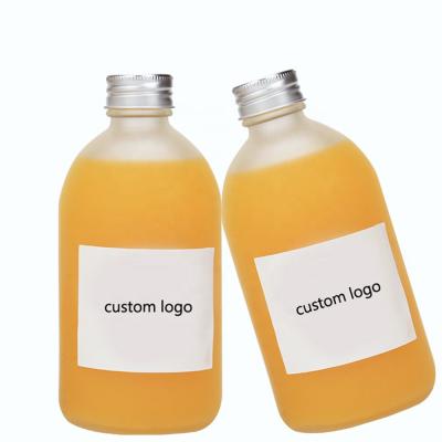 China Factory Price Environment Friendly 16oz 500ml Round Shape Boston Glass Juice Bottle With Lids for sale