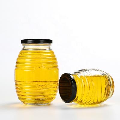 China Eco-freindly fancy 100ml 250ml 500ml 750ml threaded round shape glass honey jar with screw lid for sale