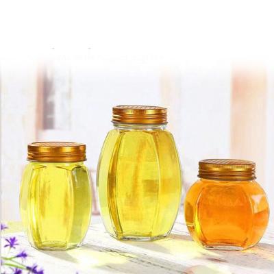 China Good Quality Empty Hexagonal Marine Food Jams Chutney Storage Honey Bottle Glass Jars With Metal Lid for sale