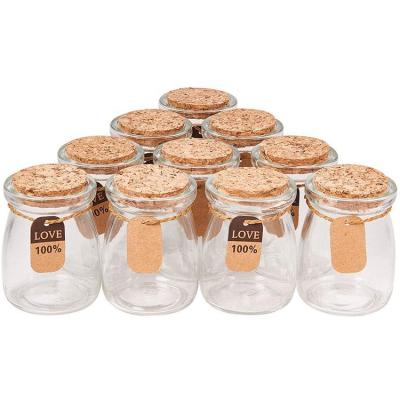 China Environmental Friendly Transparent Cup Packaging Mini Yogurt Milk Jars Pudding Glass Bottle With Cork Lid for sale