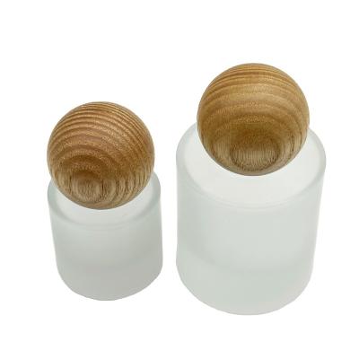 China Cosmetic OEM&ODM Luxury Cosmeticskin care frosted round bottle Essintial oil packaging with wooden cap for 15 30ML for sale