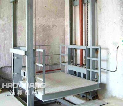 China Industrial Building Material Stores Mezzanine Floor Hydraulic Cargo Lift For Goods Price for sale