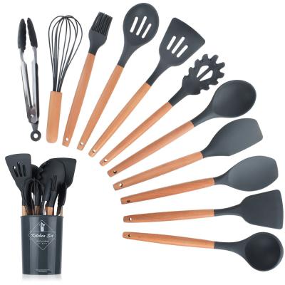 China Stocked Set of 11 Durable Cookware Tools Silicone Kitchen Cookware Set with Wooden Handles for sale