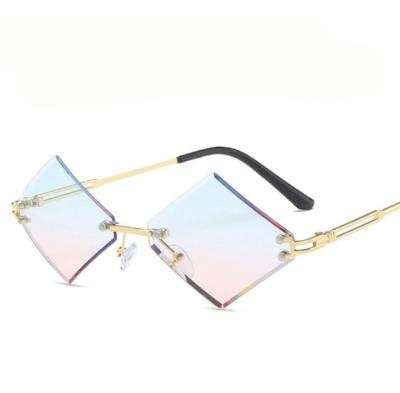 China Fashion sunglasses 2021 unique design women's sunglasses new fashionable metal rimless rhombus for sale