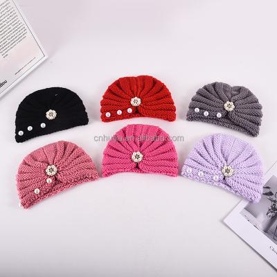 China Hot Sale Fashion Wholesale Fashion Knitted Baby Hat With Bowknot Winter Solid Toddler Children Warm Hats Caps for sale