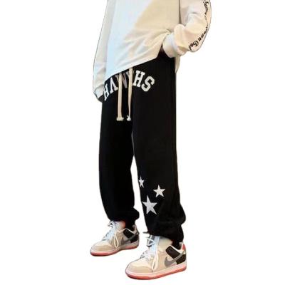 China Anti-wrinkle autumn and winter street hip hop alphabet printed breeches men's dark bond Harlan casual leg pants for sale