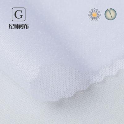 China 100% Interlining Elastic Fusible Interlining Tube Jacquard Polyester Circular Interlining Fabric for sale